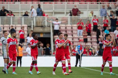 The Middlesbrough team applaud the fans at full time 