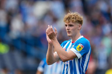 Jack Rudoni #22 of Huddersfield Town salutes the fans after the match