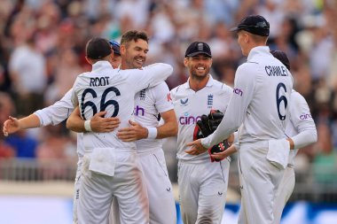 James Anderson of England celebrates with Joe Root after taking the wicket of Kagiso Rabada of South Africa for 2 runs