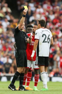 Joo Palhinha #26 of Fulham is shown a yellow card  