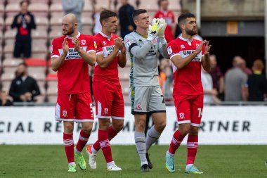 The Middlesbrough team applaud the fans at full time 
