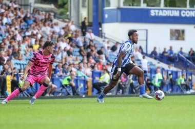 Mallik Wilks #7 of Sheffield Wednesday gets past Corey O'Keeffe #2 of Forest Green Rovers