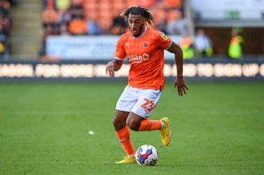 Dominic Thompson #23 of Blackpool makes a break with the ball