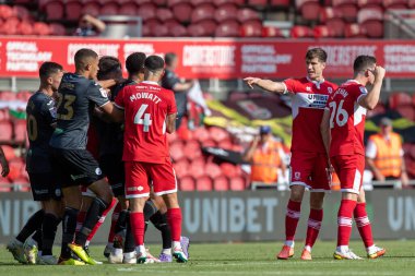 The two teams come together during the second half after Ben Cabango #5 of Swansea City throws Isaiah Jones to the floor 