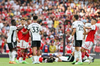 Gabriel Jesus #9 of Arsenal is held back during an altercation with Joo Palhinha #26 of Fulham  