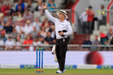 Umpire CB Gaffaney indicates the new ball is being taken