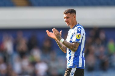 Marvin Johnson #18 of Sheffield Wednesday applauds the home fans after the final whistle