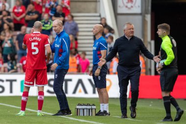 Matt Clarke #5 speaks with the coaching staff during the game 
