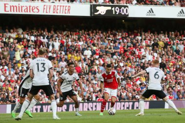 Gabriel Martinelli #11 of Arsenal on the ball surrounded by Fulham players 