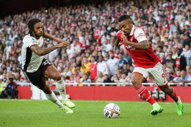 Gabriel Jesus #9 of Arsenal runs at Kevin Mbabu #27 of Fulham 