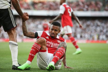 Gabriel Jesus #9 of Arsenal is helped to his feet 