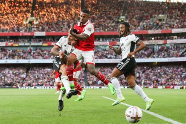 Gabriel Jesus #9 of Arsenal and Aleksandar Mitrovi #9 of Fulham collide during a tackle  