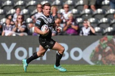 Jordan Lane #13 of Hull FC runs in to score his try to make it 32-6
