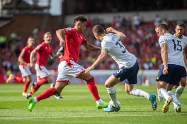 Brennan Johnson #20 of Nottingham Forest looks to drive at the Spurs defence