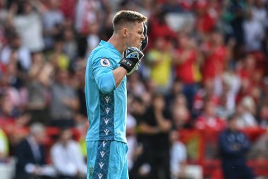 Dean Henderson #1 of Nottingham Forest reacts after saving Harry Kane #10 of Tottenham Hotspurs penalty  