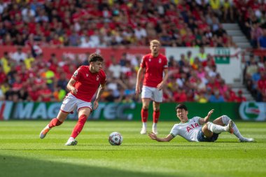 Neco Williams #7 of Nottingham Forest beats Son Heung-Min #7 of Tottenham Hotspur to the ball