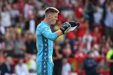 Dean Henderson #1 of Nottingham Forest reacts after saving Harry Kane #10 of Tottenham Hotspurs penalty  