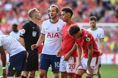 Harry Kane #10 of Tottenham Hotspur calms Brennan Johnson #20 of Nottingham Forest after Richarlison #9 of Tottenham Hotspur is fouled 