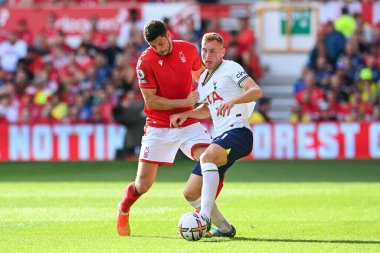 Scott McKenna #26 of Nottingham Forest and Dejan Kulusevski #21 of Tottenham Hotspur battles for the ball