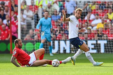 Harry Kane #10 of Tottenham Hotspur is tackled by Steve Cook #3 of Nottingham Forest