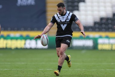 Jake Connor #1 of Hull FC puts a kick up the pitch 