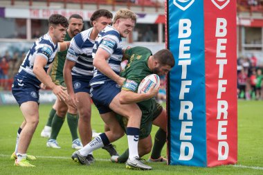 Matty Storton #13 of Hull KR goes over for a try and makes the score 18-6 during the first half 