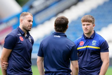 Luke Thomas #38 of Warrington Wolves and James Harrison inspect the pitch prior to the game 