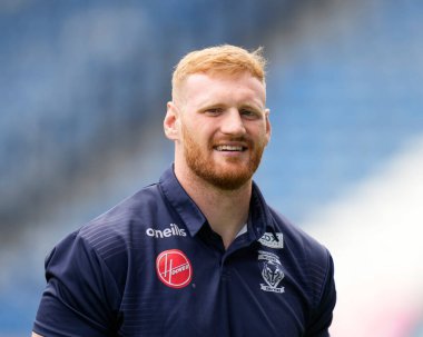 Joe Bullock #15 of Warrington Wolves inspects the pitch prior to the game 
