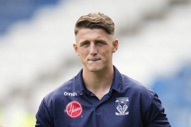 Josh Lynch #40 of Warrington Wolves inspects the pitch before making his debut today