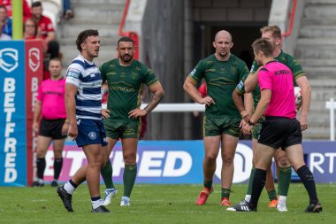 Oliver Partington #17 of Wigan Warriors is awarded a yellow card and put in the sin bin by Referee Chris Kendall  after a high tackle 