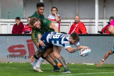 Ben O'Keefe #38 of Wigan Warriors goes over for a try and makes the score 32-10 during the second half 