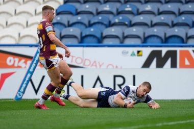 Matt Dufty #36 of Warrington Wolves dives over to score his hat trick try 