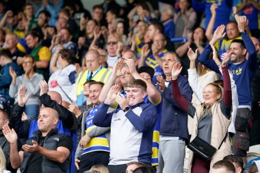 Warrington Wolves fans cheer on their sides valiant come back 