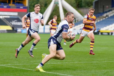 Matt Dufty #36 of Warrington Wolves runs in a try 