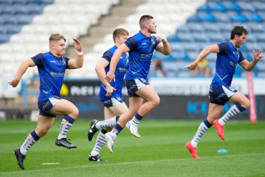 Leon Hayes #39 of Warrington Wolves and Danny Walker warm up before the match 