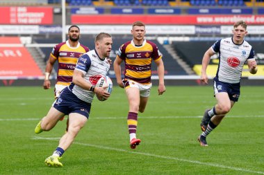 Matt Dufty #36 of Warrington Wolves runs in a try 
