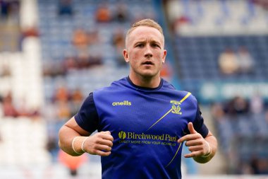 Jason Clark #14 of Warrington Wolves warms up before the match 