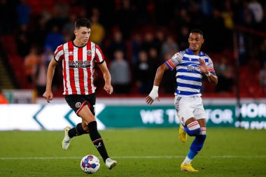 Anel Ahmedhodzic #15 of Sheffield United and Tom Ince #10 of Reading during the Sky Bet Championship match Sheffield United vs Reading at Bramall Lane, Sheffield, UK, 30th August 2022