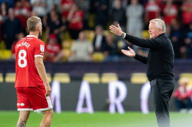 Chris Wilder Manager of Middlesbrough gives instructions to Riley McGree #8 of Middlesbrough
