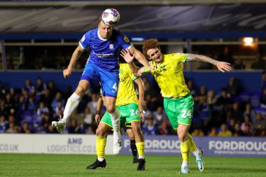 Marc Roberts #4 of Birmingham City heads the ball whilst under pressure from Josh Sargent #24 of Norwich City