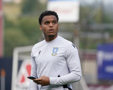 Akin Famewo #15 of Sheffield Wednesday inspects the pitch before the game 