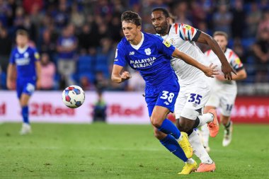Perry Ng #38 of Cardiff City  Under pressure from Cameron Jerome #35 of Luton Town 