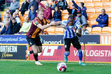 Luke Hendrie #17 of Bradford City holds back Jaden Brown #3 of Sheffield Wednesday 