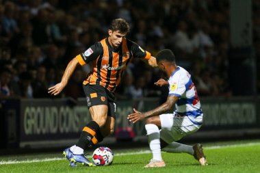 Ryan Longman #16 of Hull City runs at Kenneth Paal #22 of QPR 