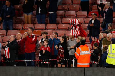 A fan of Sheffield United holds up a shirt with Iliman Ndiaye #29 of Sheffield United on the back during the Sky Bet Championship match Sheffield United vs Reading at Bramall Lane, Sheffield, UK, 30th August 2022