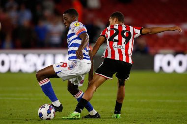 Tyrese Fornah #19 of Reading and Iliman Ndiaye #29 of Sheffield United during the Sky Bet Championship match Sheffield United vs Reading at Bramall Lane, Sheffield, UK, 30th August 2022