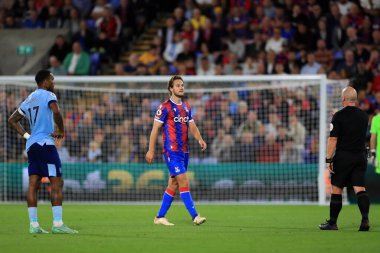 Referee, Simon Hooper speaks with Joachim Andersen #16 of Crystal Palace after his altercation with Ivan Toney #17 of Brentford 