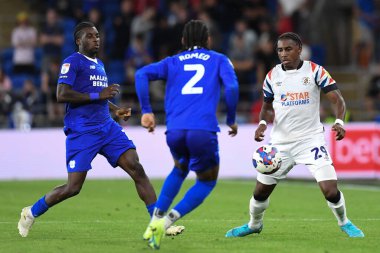 Amarii Bell #29 of Luton Town takes on Mahlon Romeo #2 of Cardiff City   
