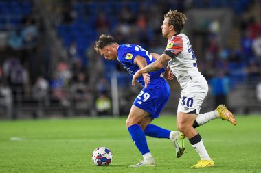 Mark Harris #29 of Cardiff City  Under pressure from Luke Freeman #30 of Luton Town 