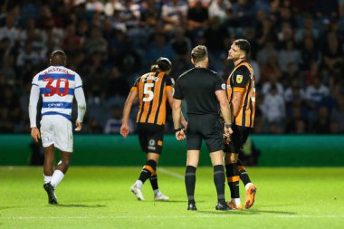 Tobias Figueiredo #6 of Hull City is spoken to by the referee 